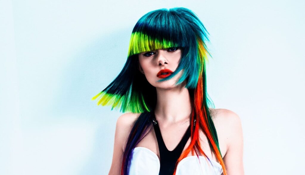 Future Femme by Brooke LeMasters - Retro-futuristic hairstyle collection featuring vibrant colors, bold shapes, and modern femininity. Published in The Hair Magazine."