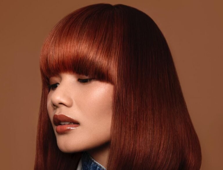 A striking hairstyle from the Vintage Vanguard collection by Michelle Summers Davies, showcasing bold, vintage-inspired styles with modern elements.