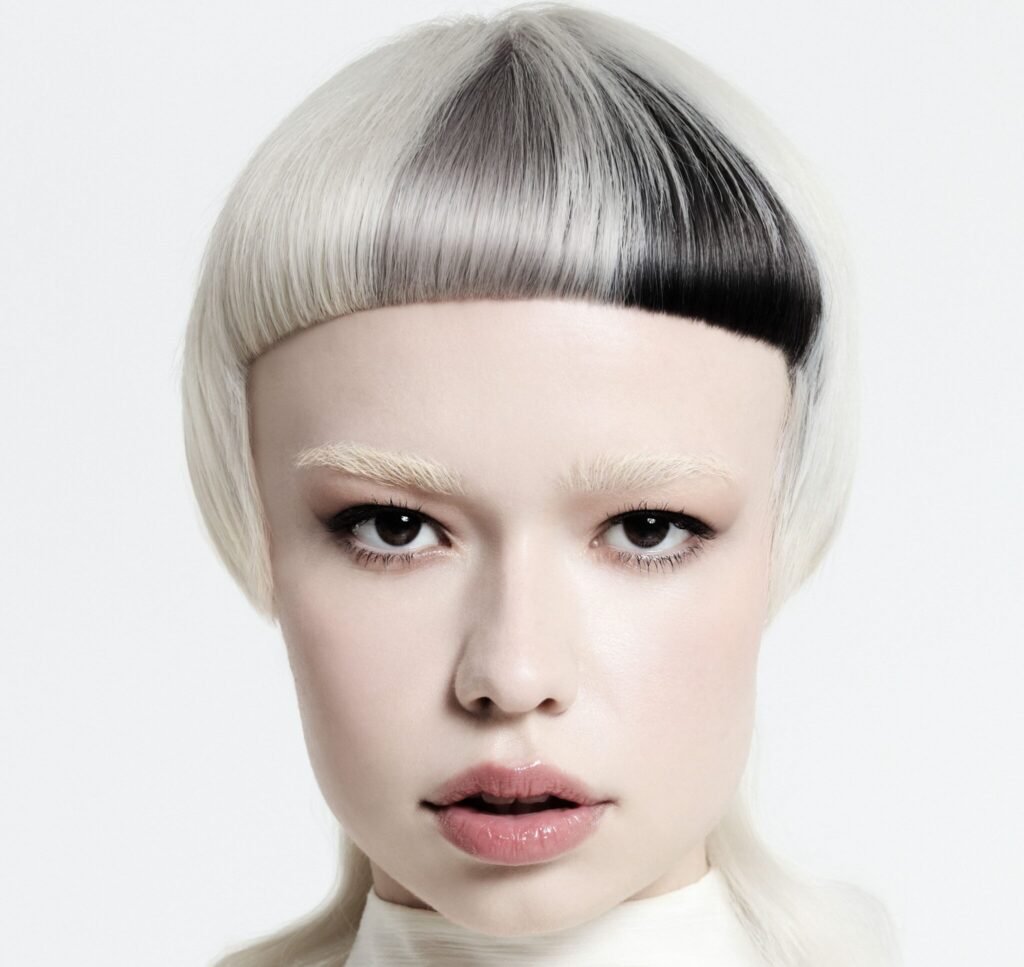 Cloud Dancer Pantone Color of the Year 2026 icy white blonde hair shade on model.